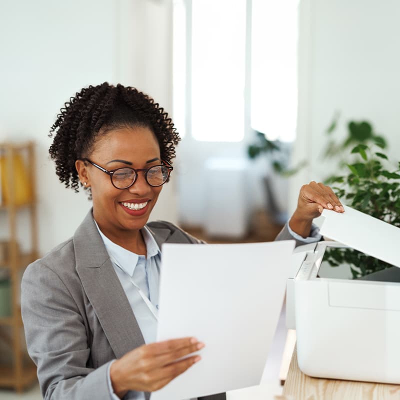 A woman looking at secured printing solutions